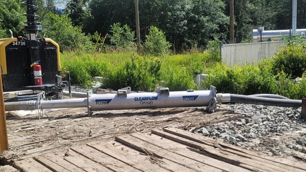 Gel flocculant reactor running on timber mats beside the treated discharge ditch