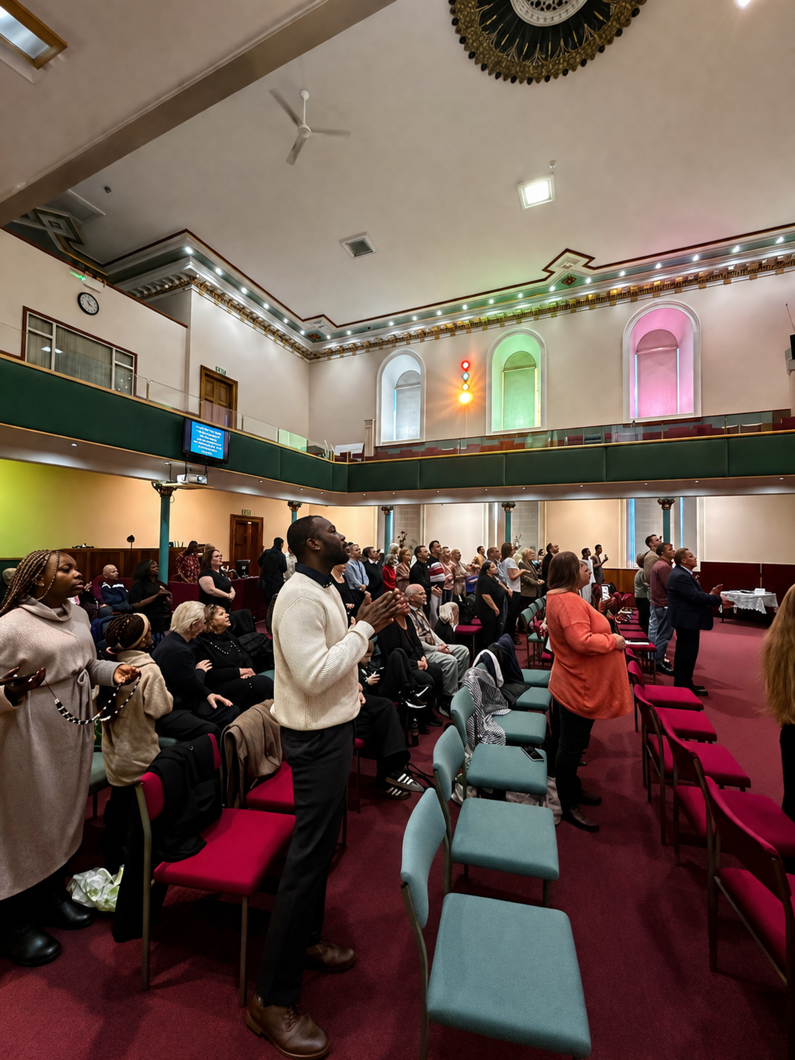 Congregation worshipping with hands raised