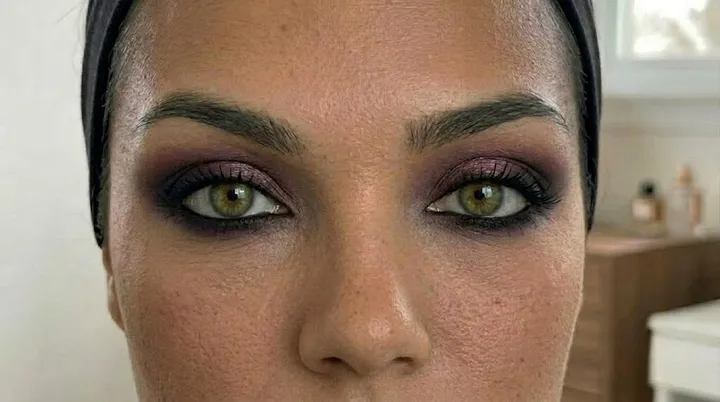 Finished Vamp Romantic eye makeup featuring smudged black kohl, burgundy smokey eyeshadow, and softly blended dramatic eyes.