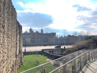 Tower of London and old city wall section seen from outside Tower Hill station