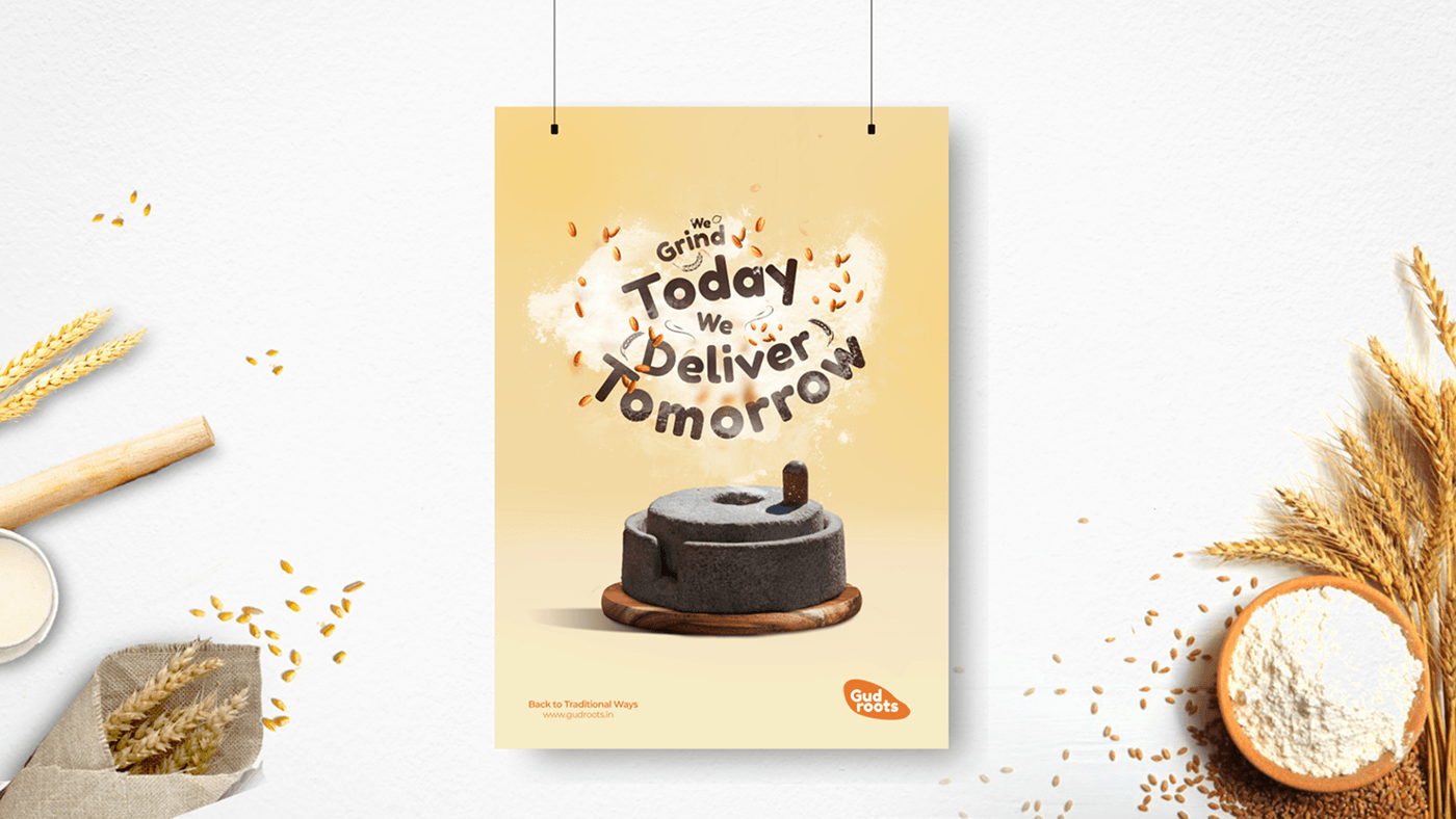 Gudroots poster reading We Grind Today, We Deliver Tomorrow with a stone mill and flour