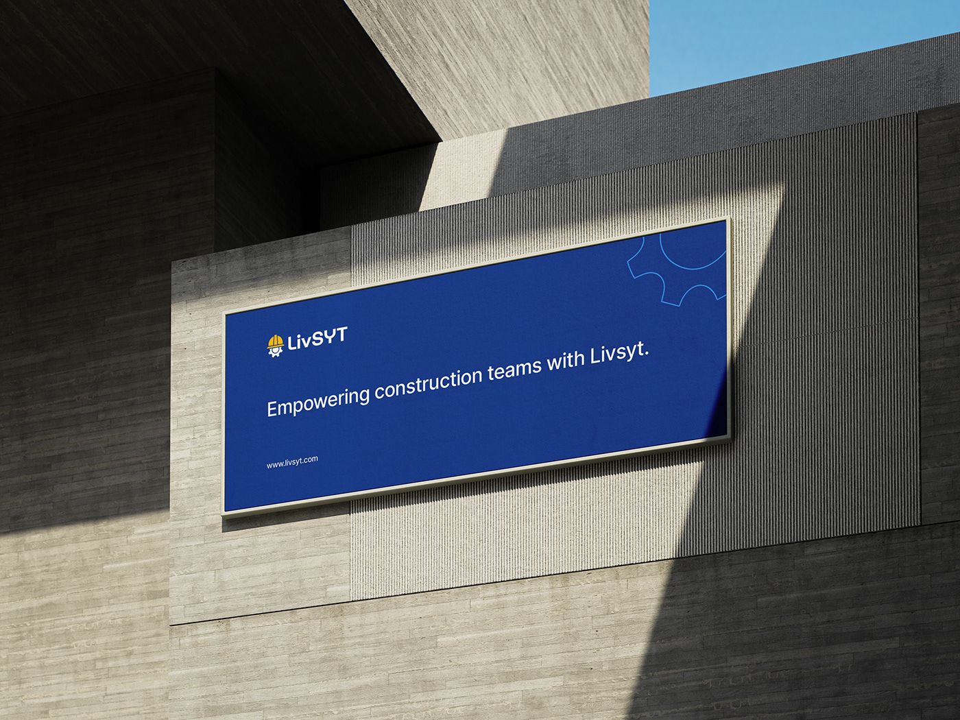 LivSYT billboard on a concrete wall reading Empowering construction teams with Livsyt