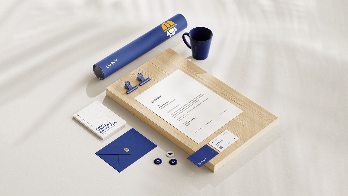 LivSYT stationery set with letterhead, envelope, business cards and a mug on a wooden board