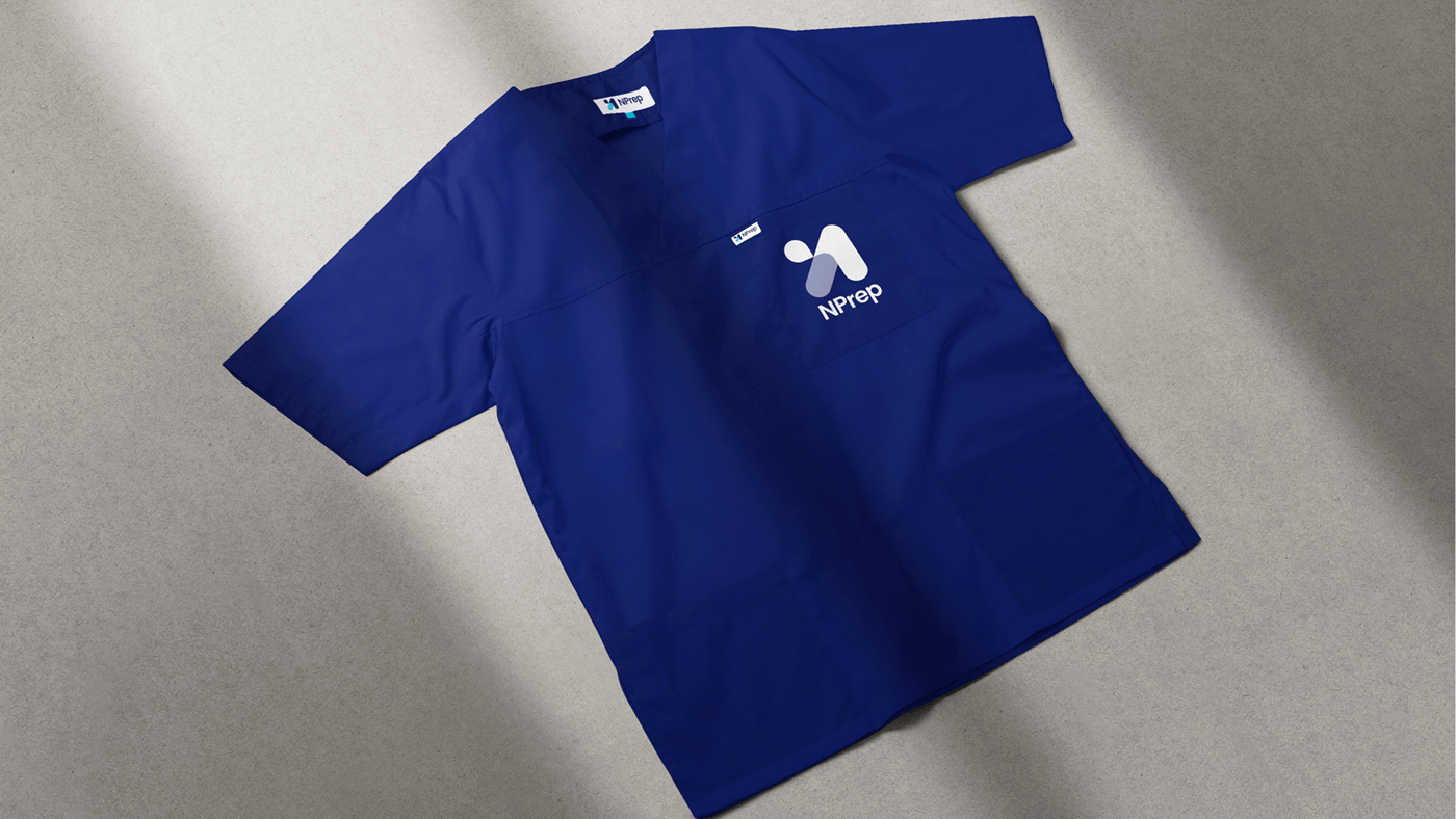 Midnight blue NPrep scrub top with the logo on the chest