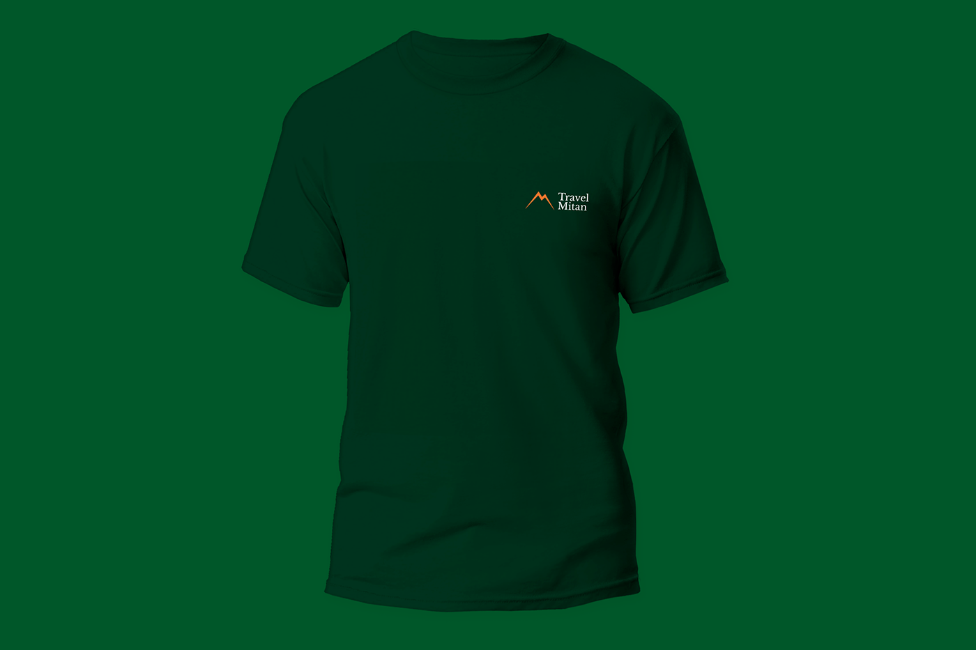 Dark green T-shirt with a small Travel Mitan logo