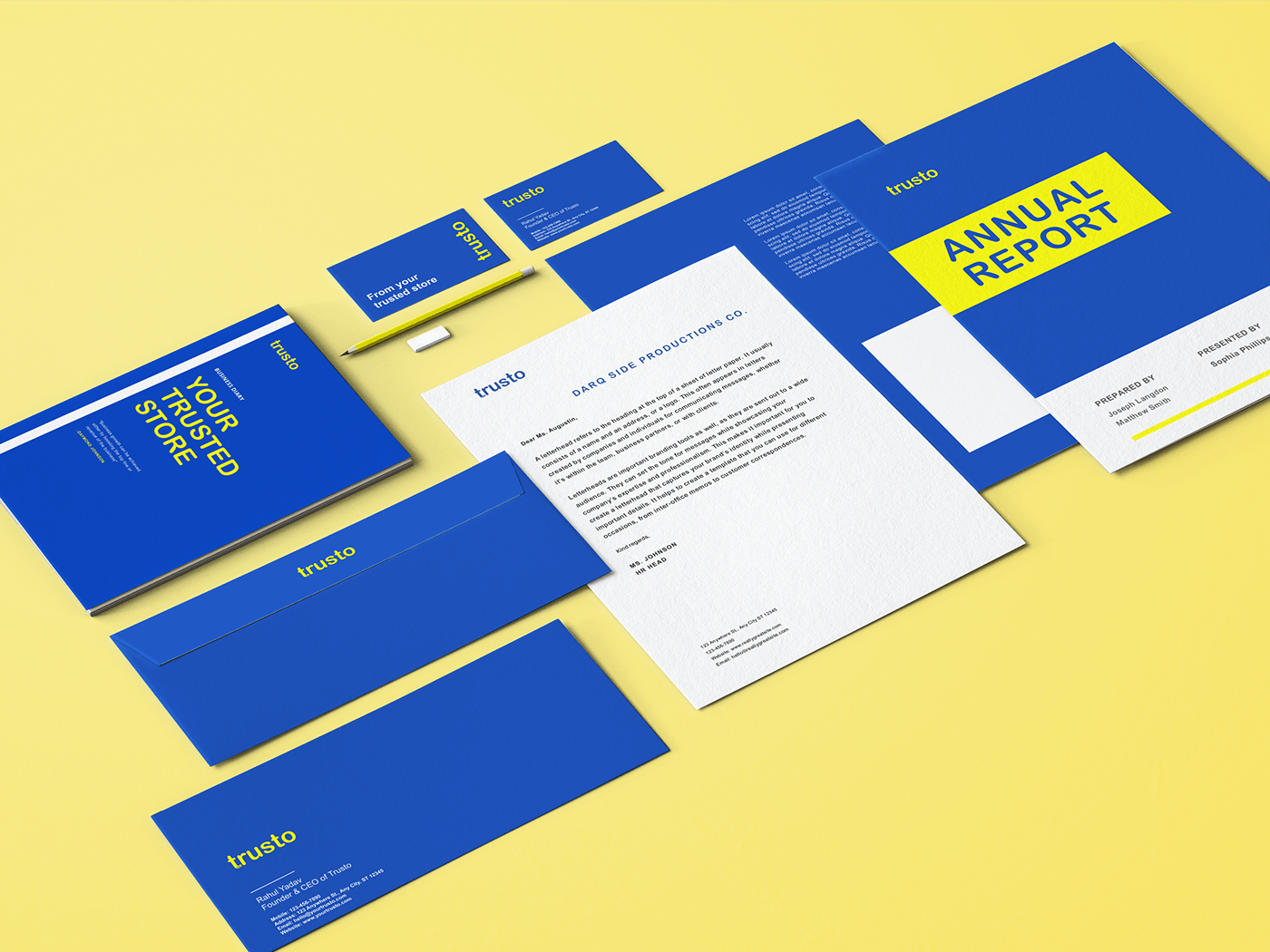 Trusto stationery in blue and yellow with envelopes, letterhead, folders and an annual report