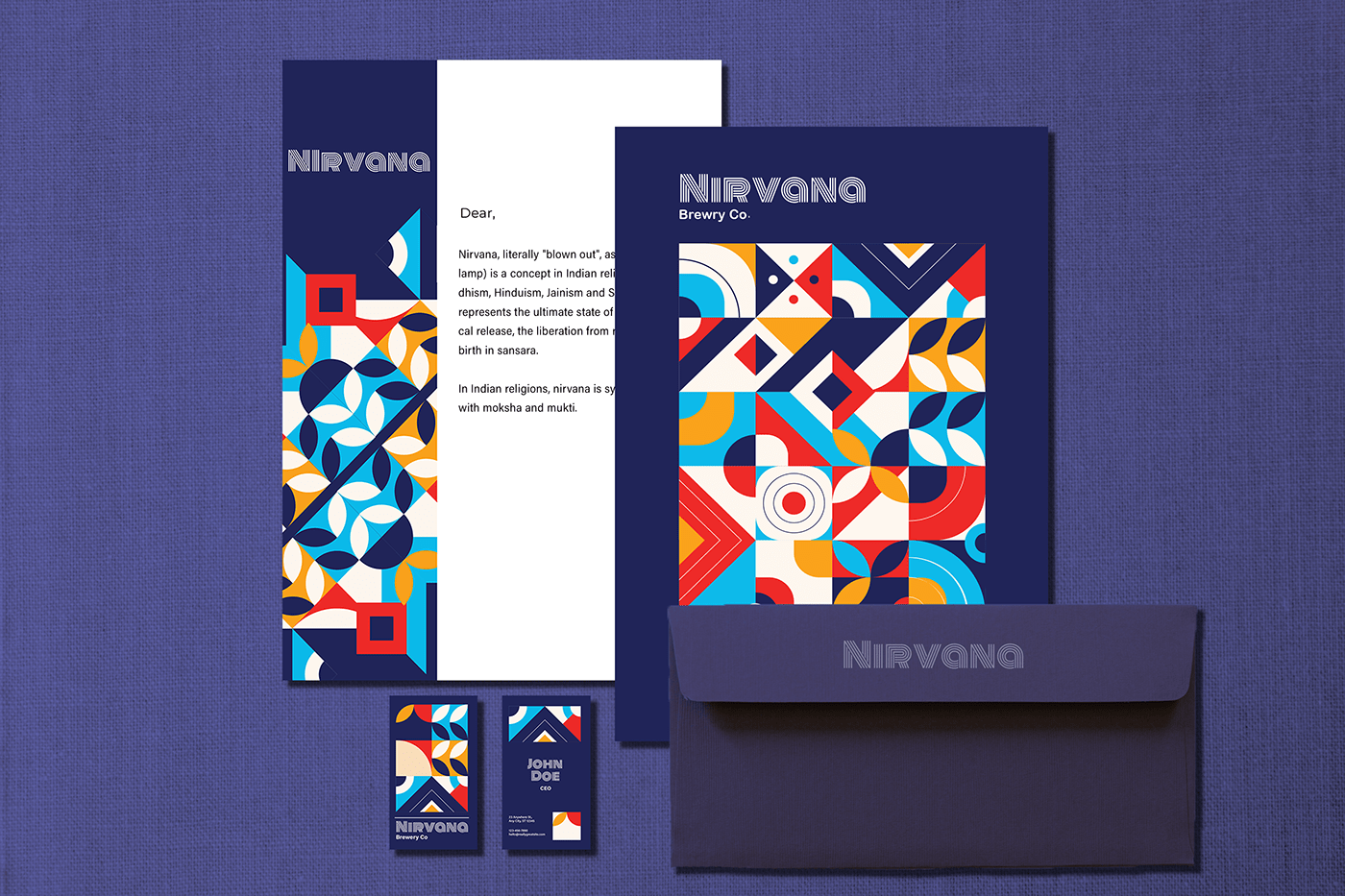 Nirvana letterhead, envelope and business cards in midnight blue with geometric patterns