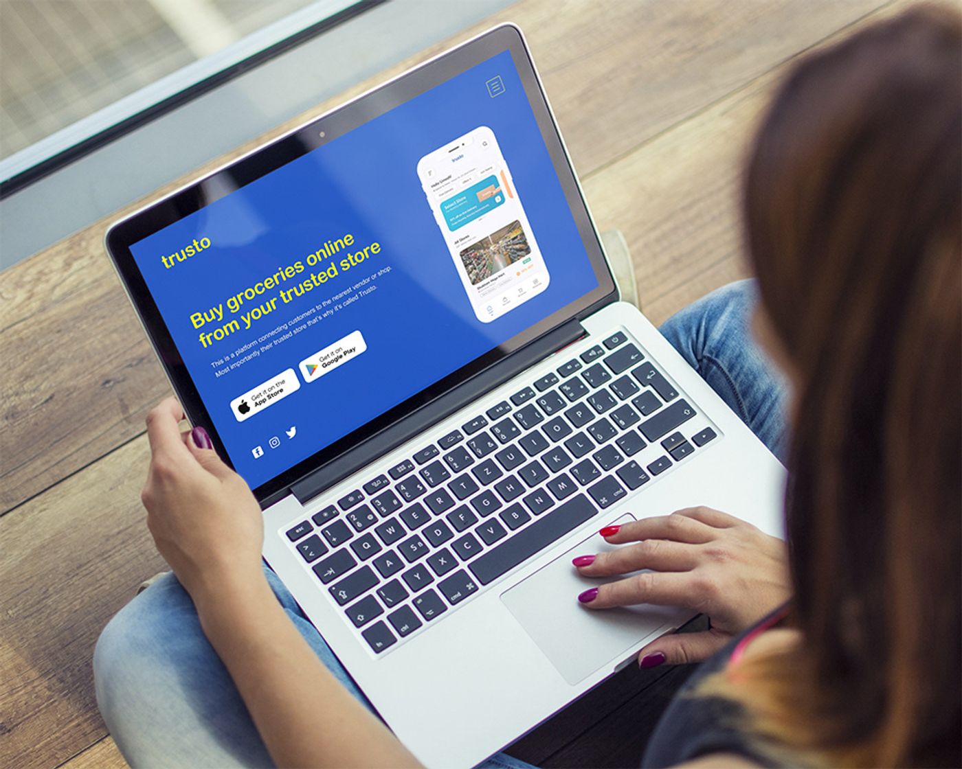 Trusto website on a laptop with the line Buy groceries online from your trusted store