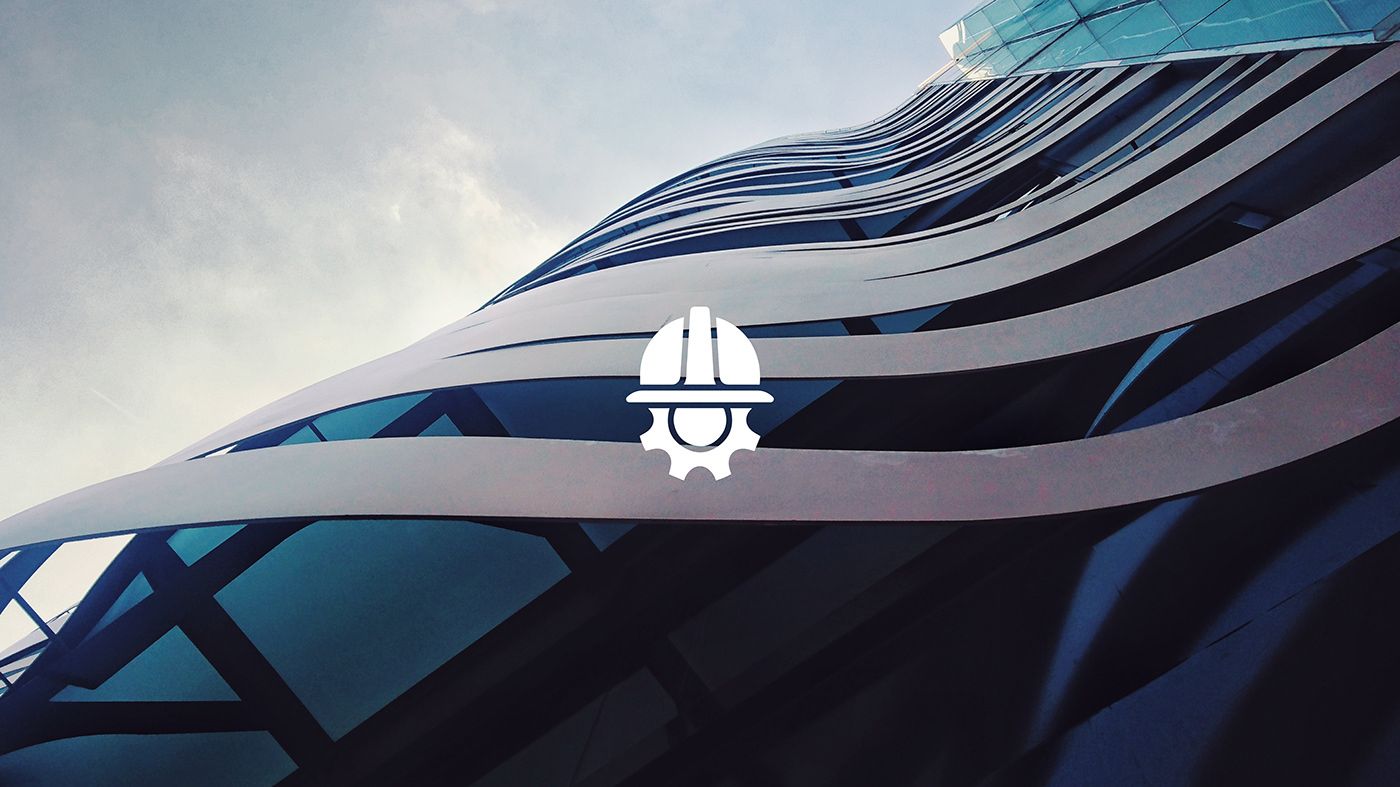 LivSYT hard-hat-and-gear logo in white over a curved glass building