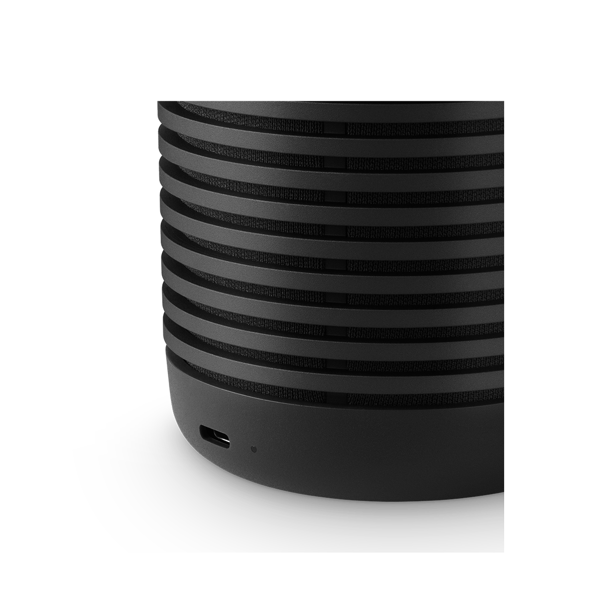Close-up of the ridged aluminium shell of the Black Anthracite Beosound Explore
