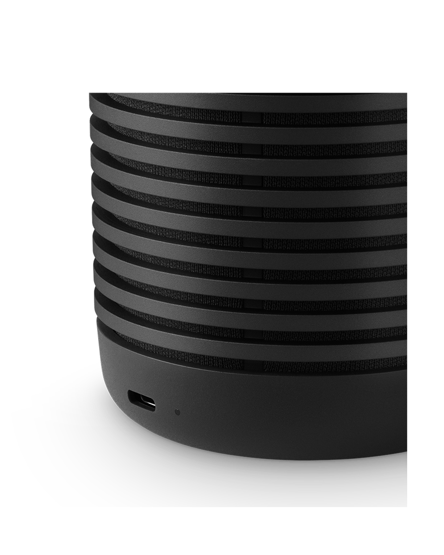 Close-up of the ridged aluminium shell of the Black Anthracite Beosound Explore