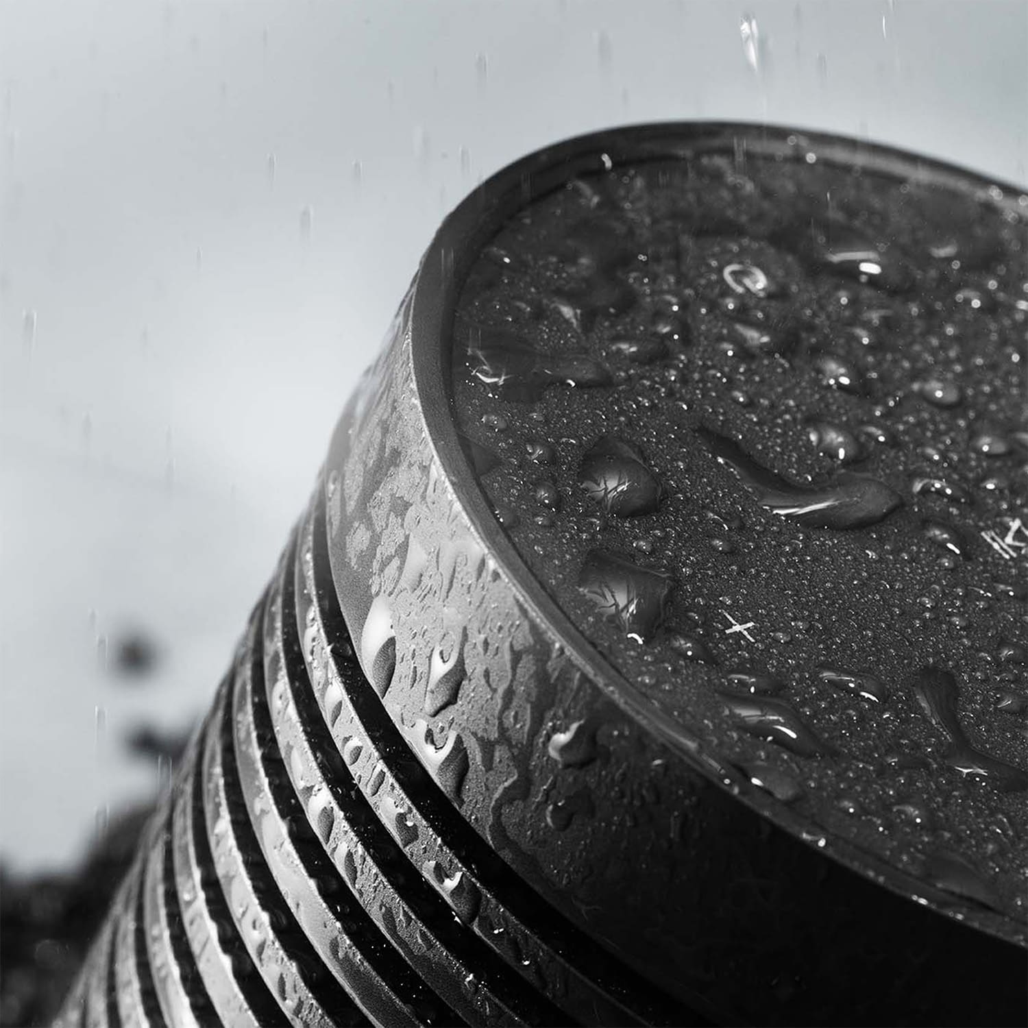 Water droplets on a Black Anthracite Beosound Explore, showing its IP67 rating