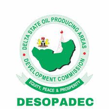 Circular green and red logo of a state oil producing areas development commission, with map and "DESOPADEC" text
