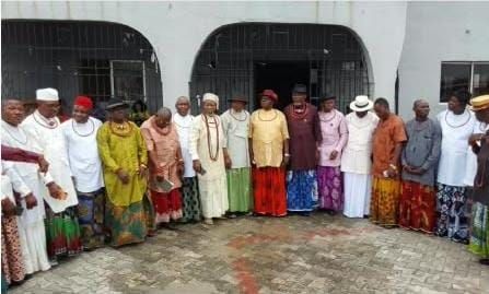 Group of men standing outside dressed in Nigerian Native Attire