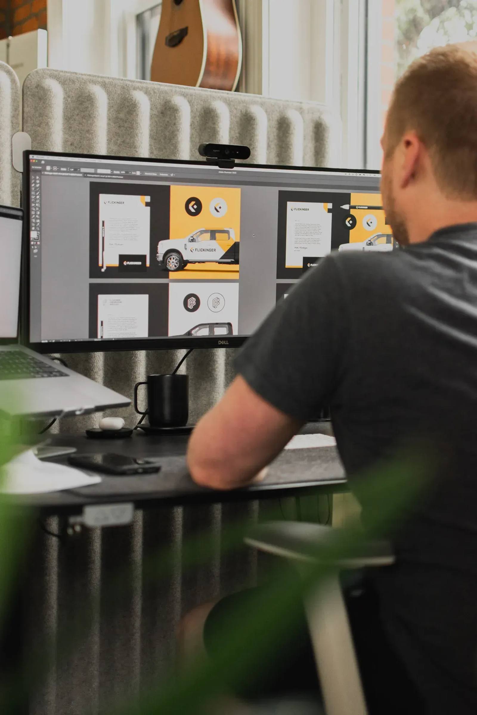 A Brave Little Beast designer working on a logo presentation deck