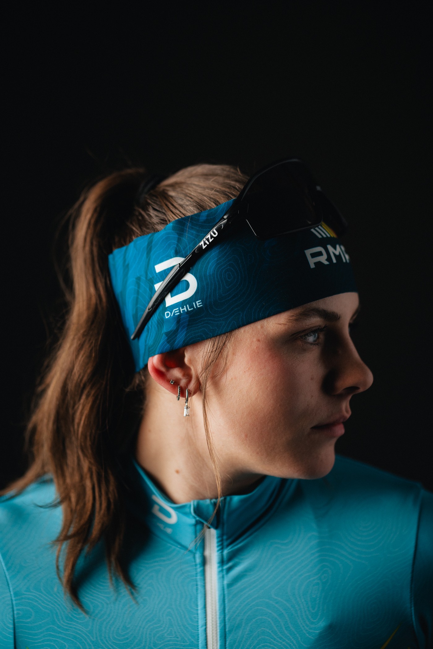 A cross country skier looks off from the camera