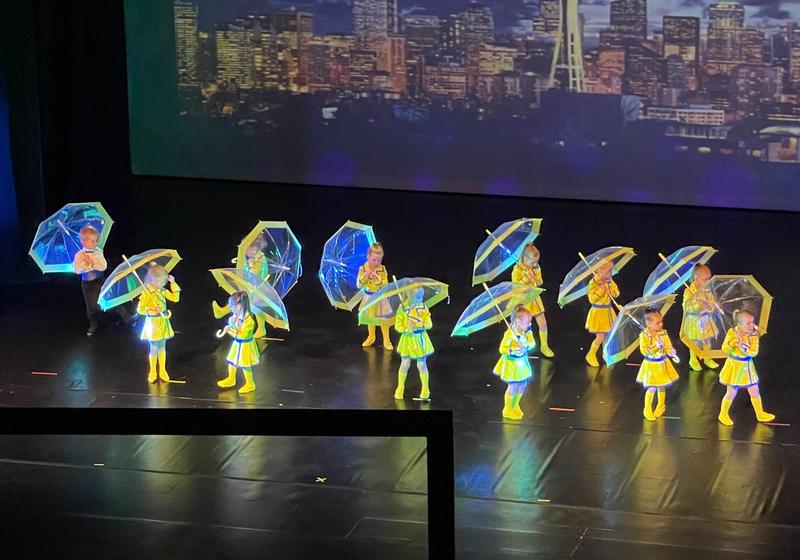 Eisley (on the far right) at her performance of Singing in the Rain