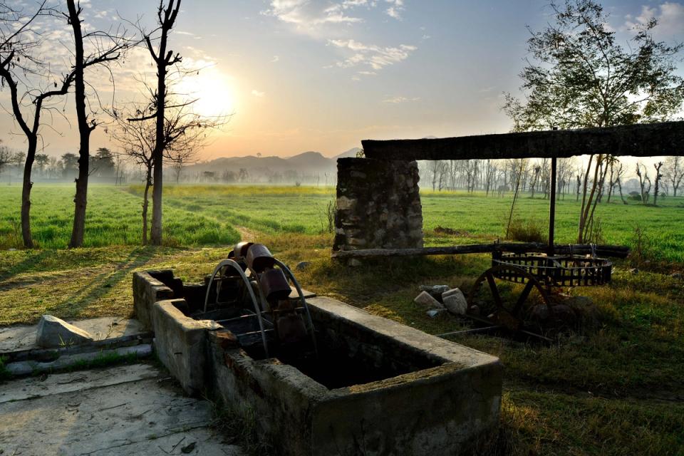 Farmland and an old irrigation well at sunrise in a village in Swabi, Khyber Pakhtunkhwa
