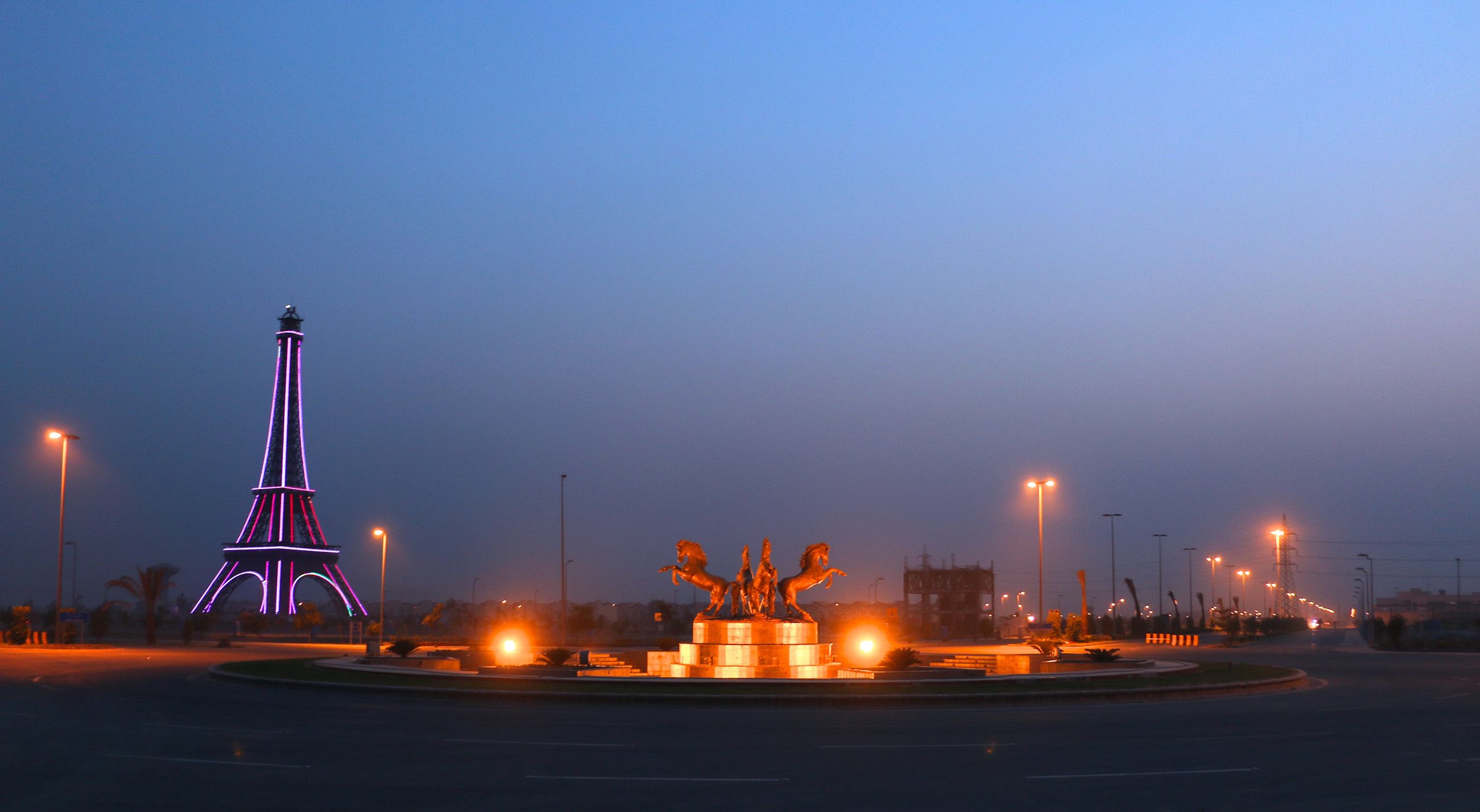 The Eiffel Tower replica in Bahria Town, Lahore, at dusk