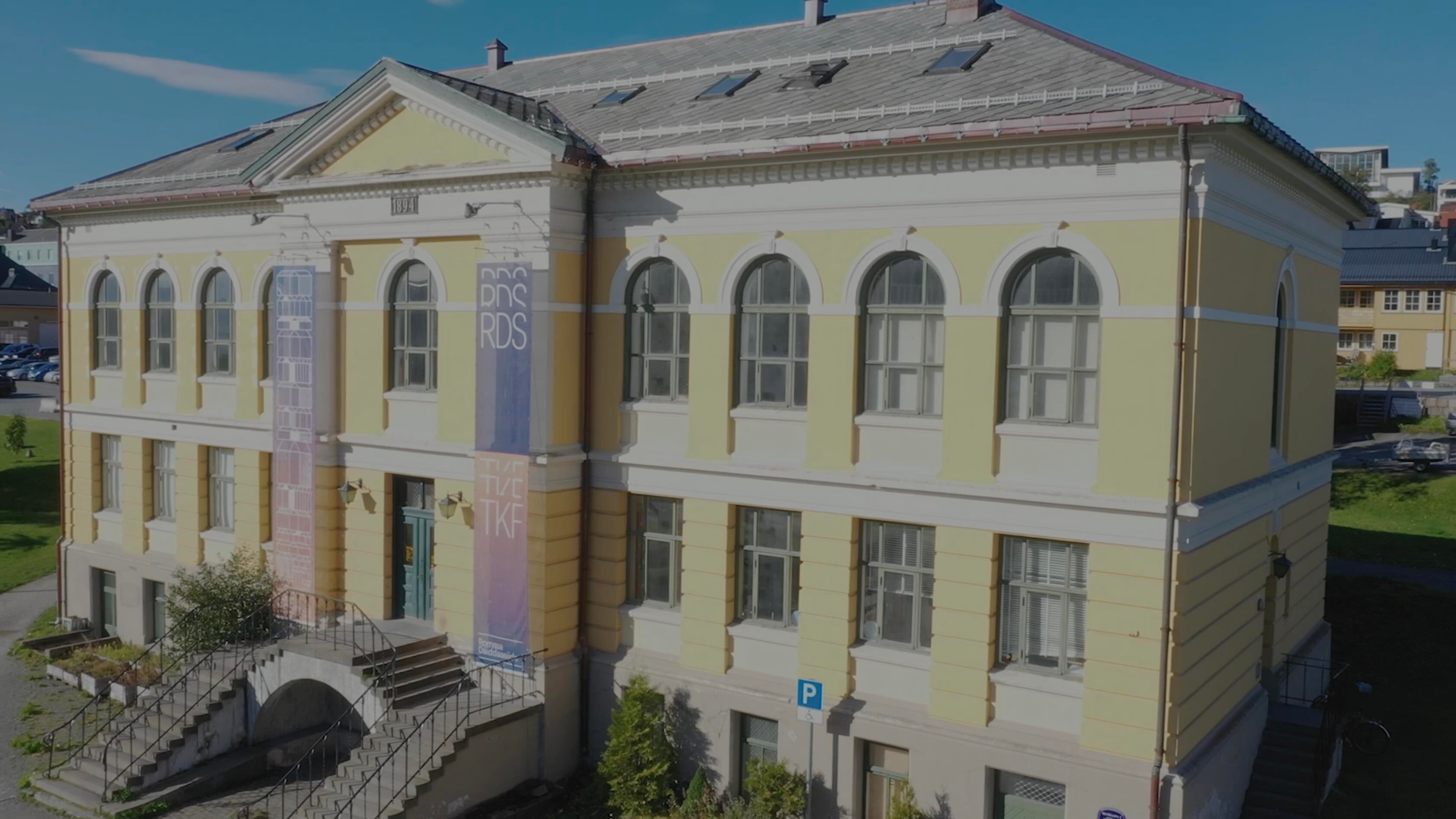 A large yellow neo-classical building