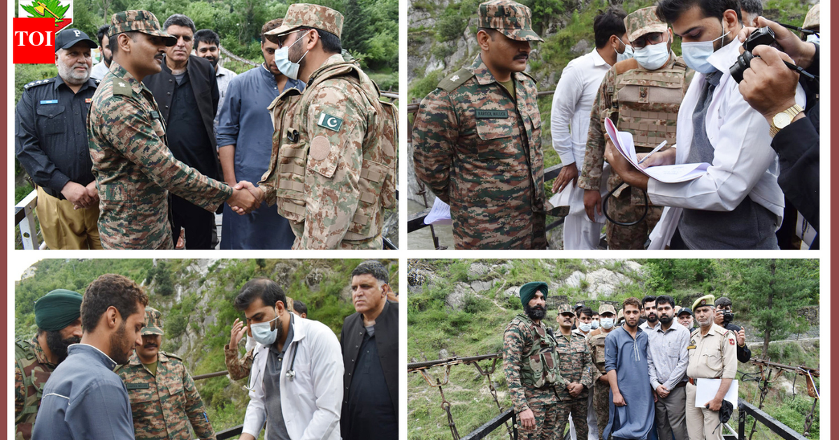 Indian, Pak Army officers shake hands during a repatriation process along LoC