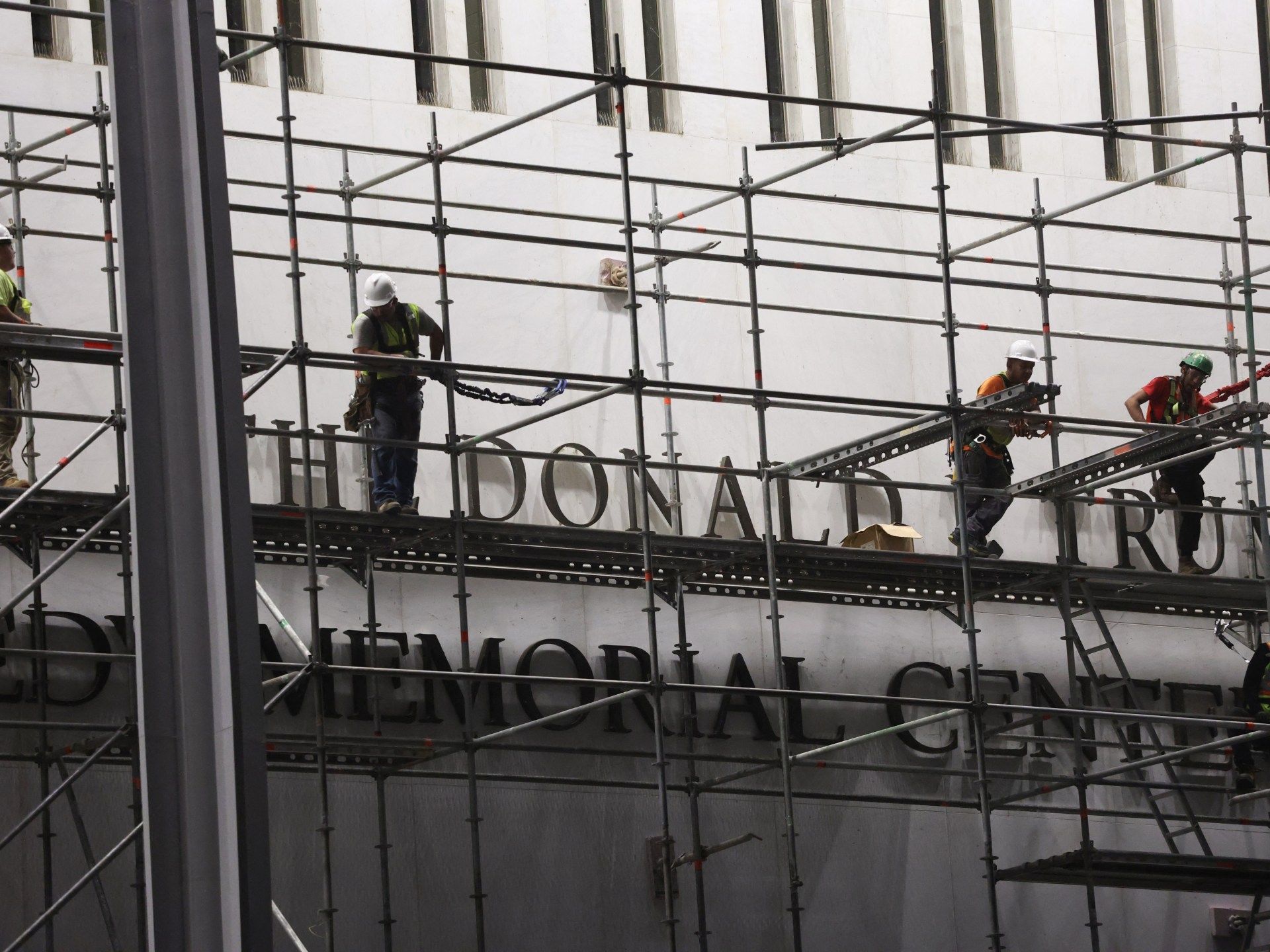 Workers remove Trump’s name from Kennedy Center after court ruling
