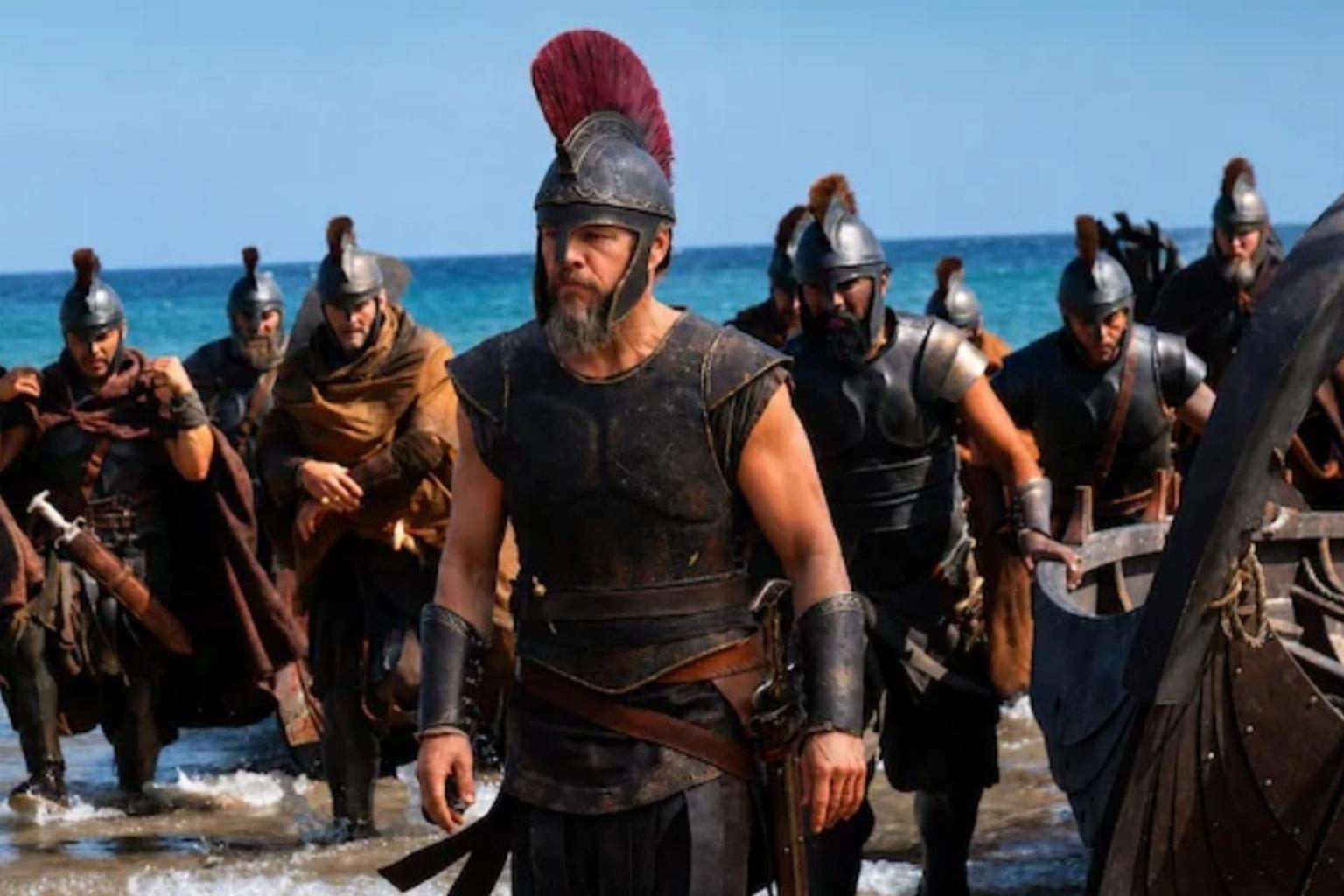 People watching The Odyssey movie in a theater