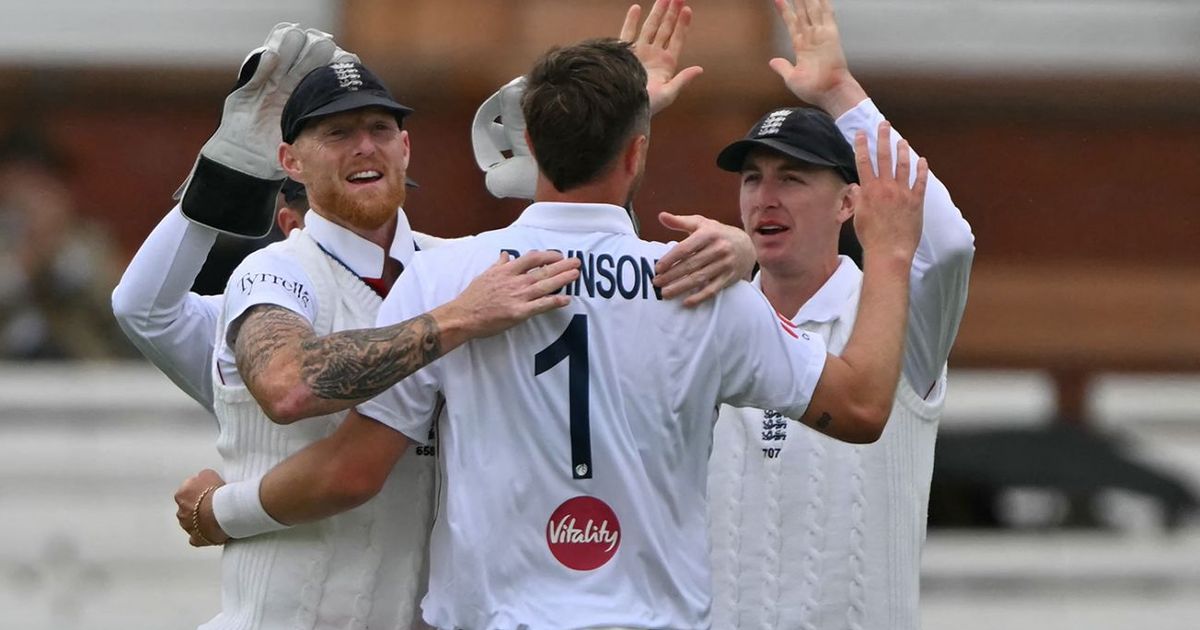 Robinson double-strike moves England closer between showers