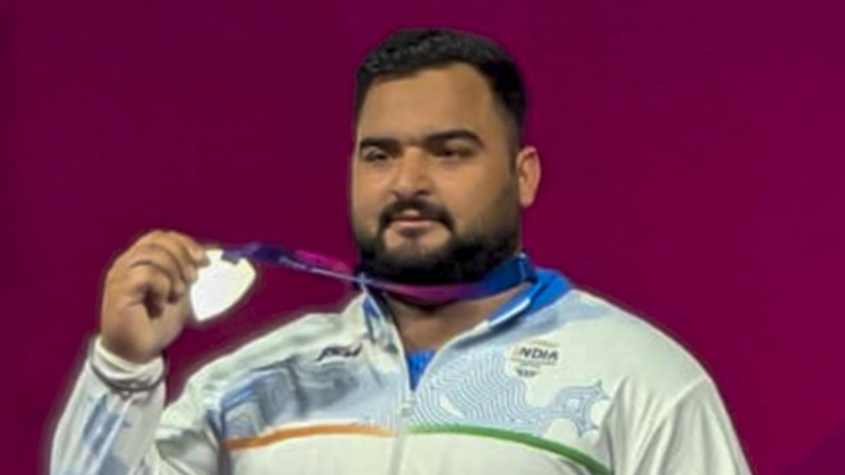 Indian athletes competing in weightlifting and discus throw events