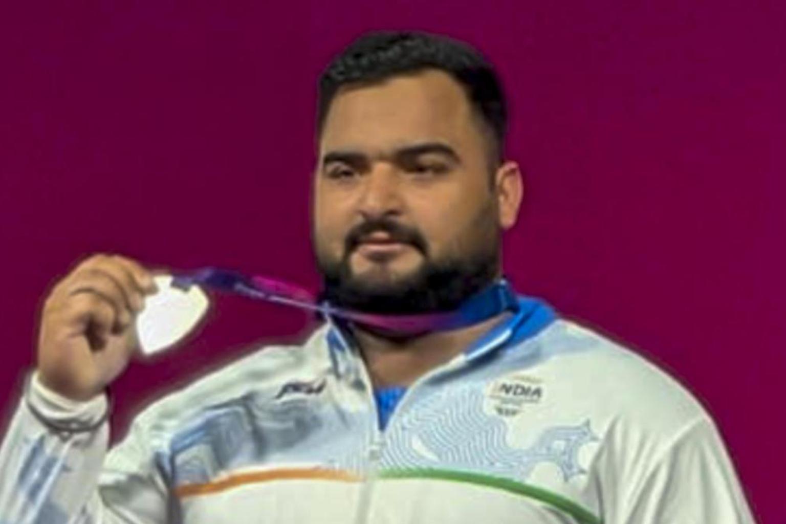 Indian athletes competing in weightlifting and discus throw events