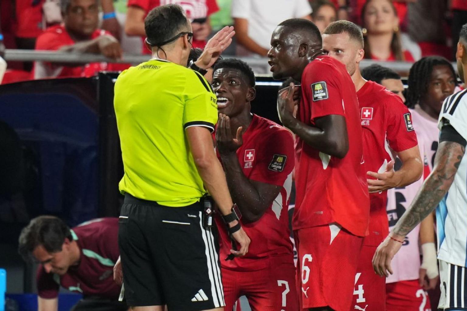 Breel Embolo being shown a red card by the referee