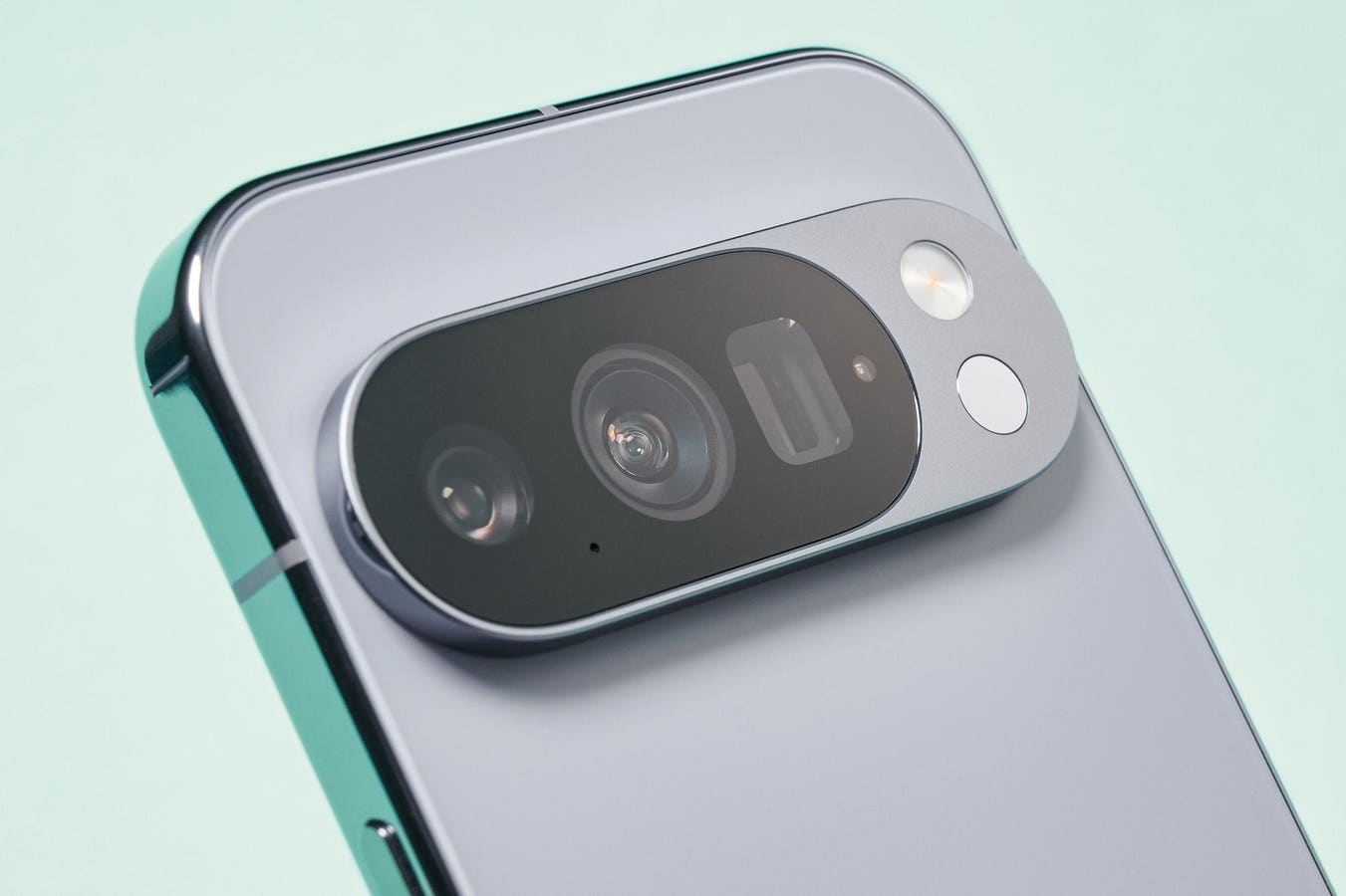 Google Pixel 11 smartphone with person holding it
