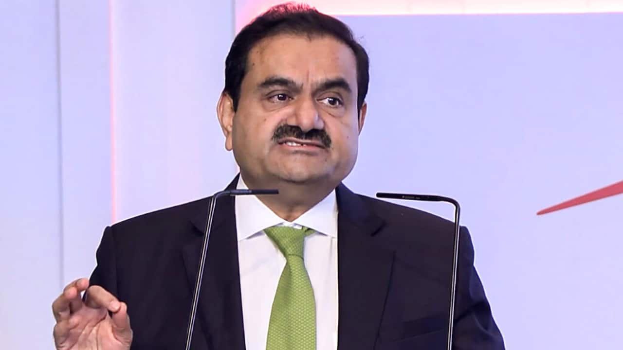 Adani family members in a business meeting, discussing real estate projects