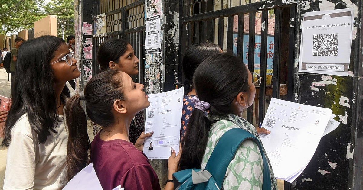 Students checking NEET UG 2026 results on their mobile phones