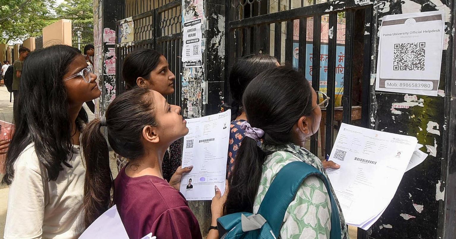 Students checking NEET UG 2026 results on their mobile phones