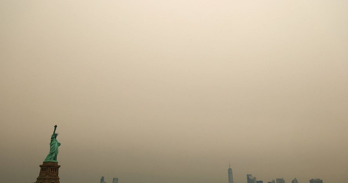 Soccer players on the field with haze in the background