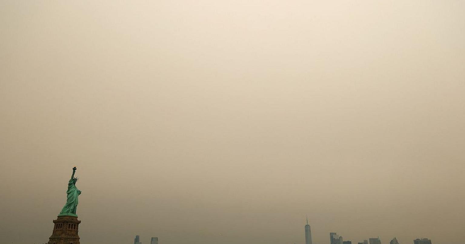 Soccer players on the field with haze in the background