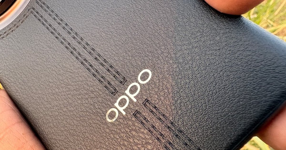 Smartphones and microchips on a table with a global map in the background