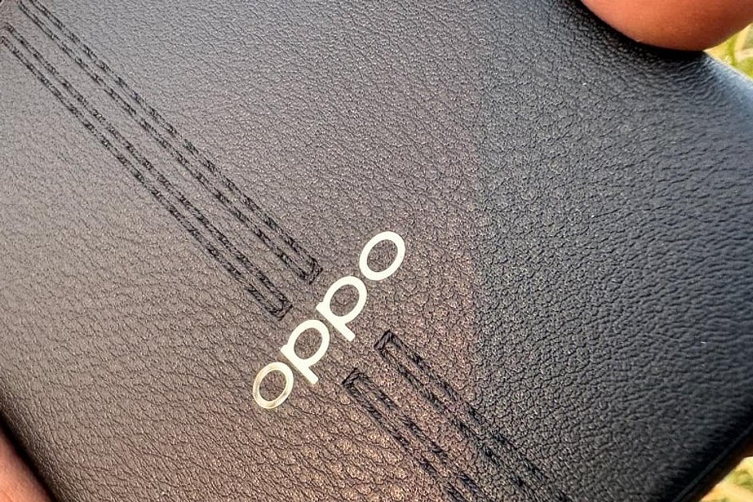 Smartphones and microchips on a table with a global map in the background