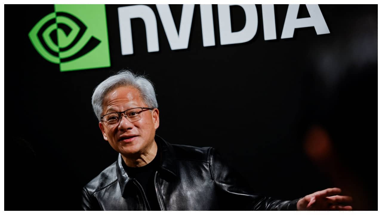 Nvidia and SK Group executives shaking hands at a press conference