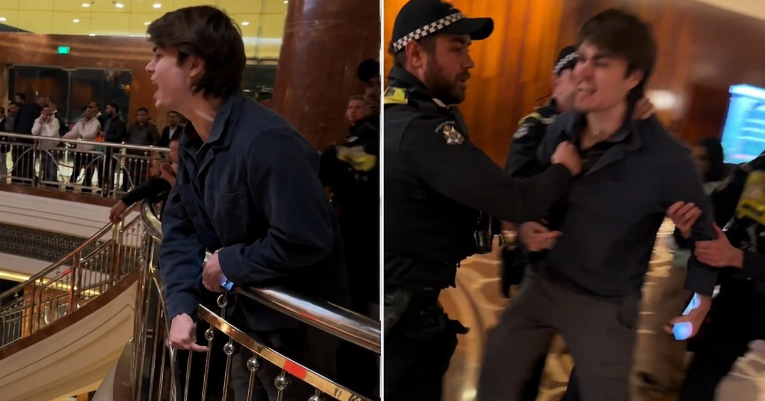 Protester outside PM Modi's hotel in Melbourne, Australia, with security personnel