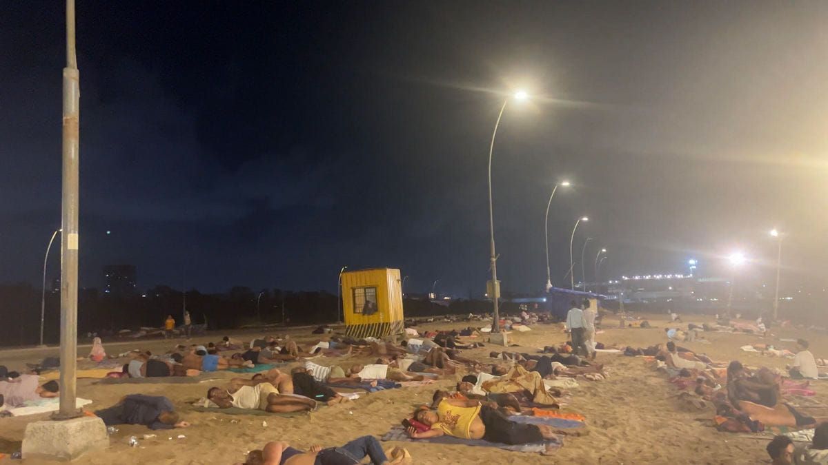 Mumbai heat has turned Versova beach into a bedroom. Who is sleeping there?