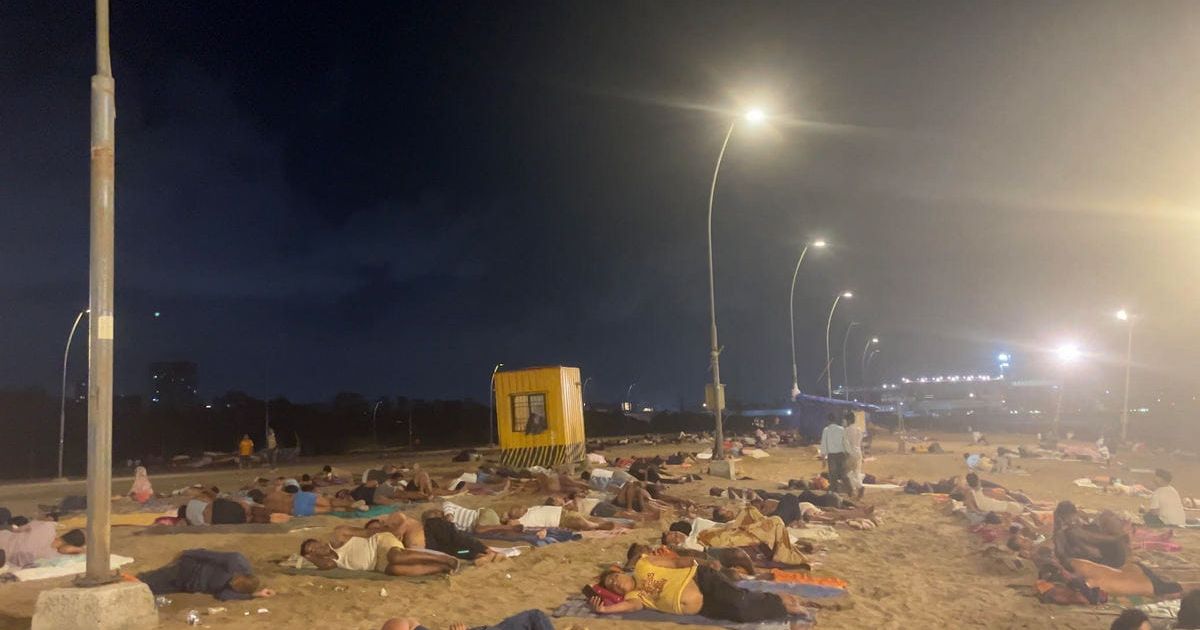 Mumbai heat has turned Versova beach into a bedroom. Who is sleeping there?