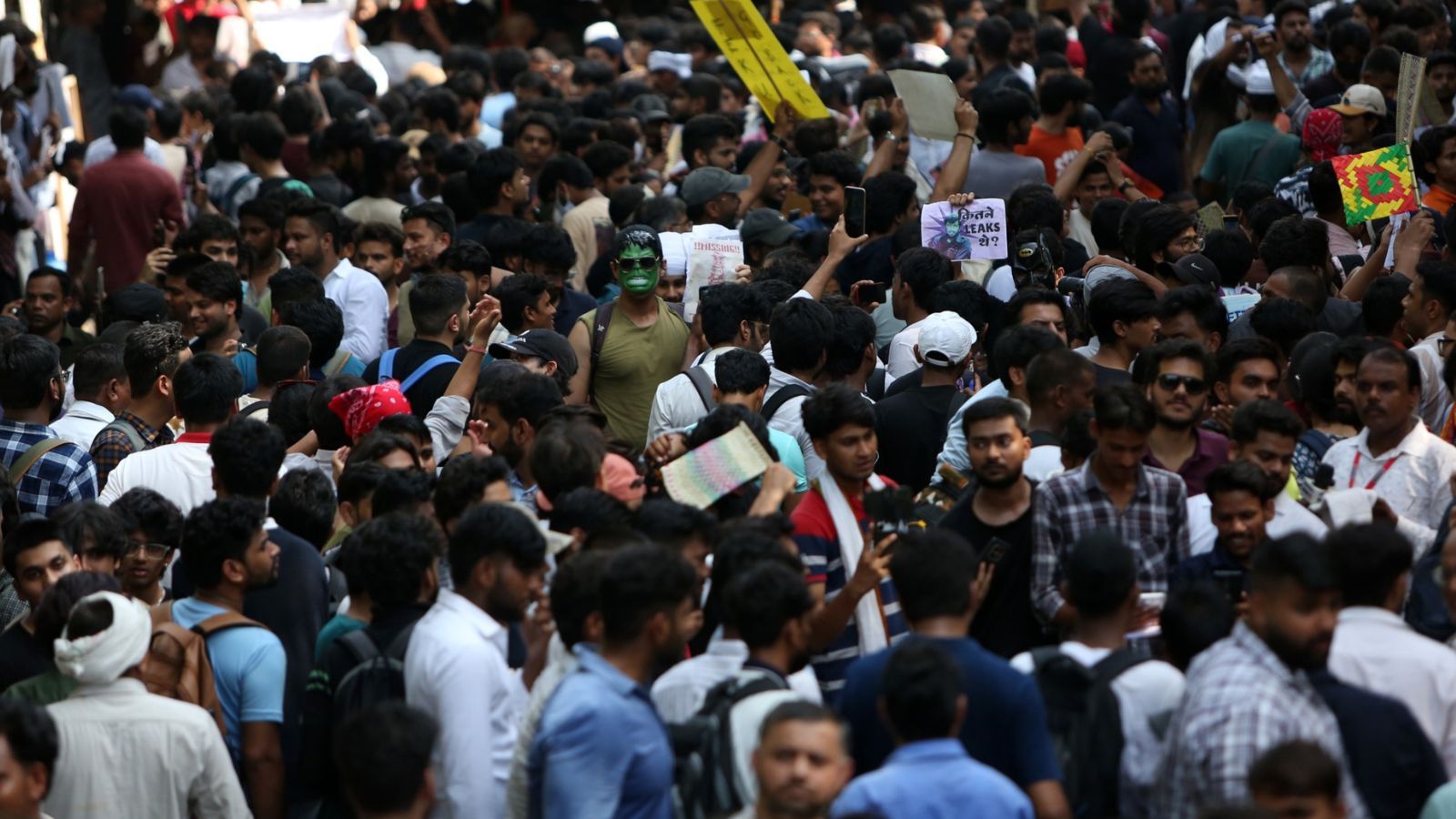 Students protesting on the streets with placards and banners