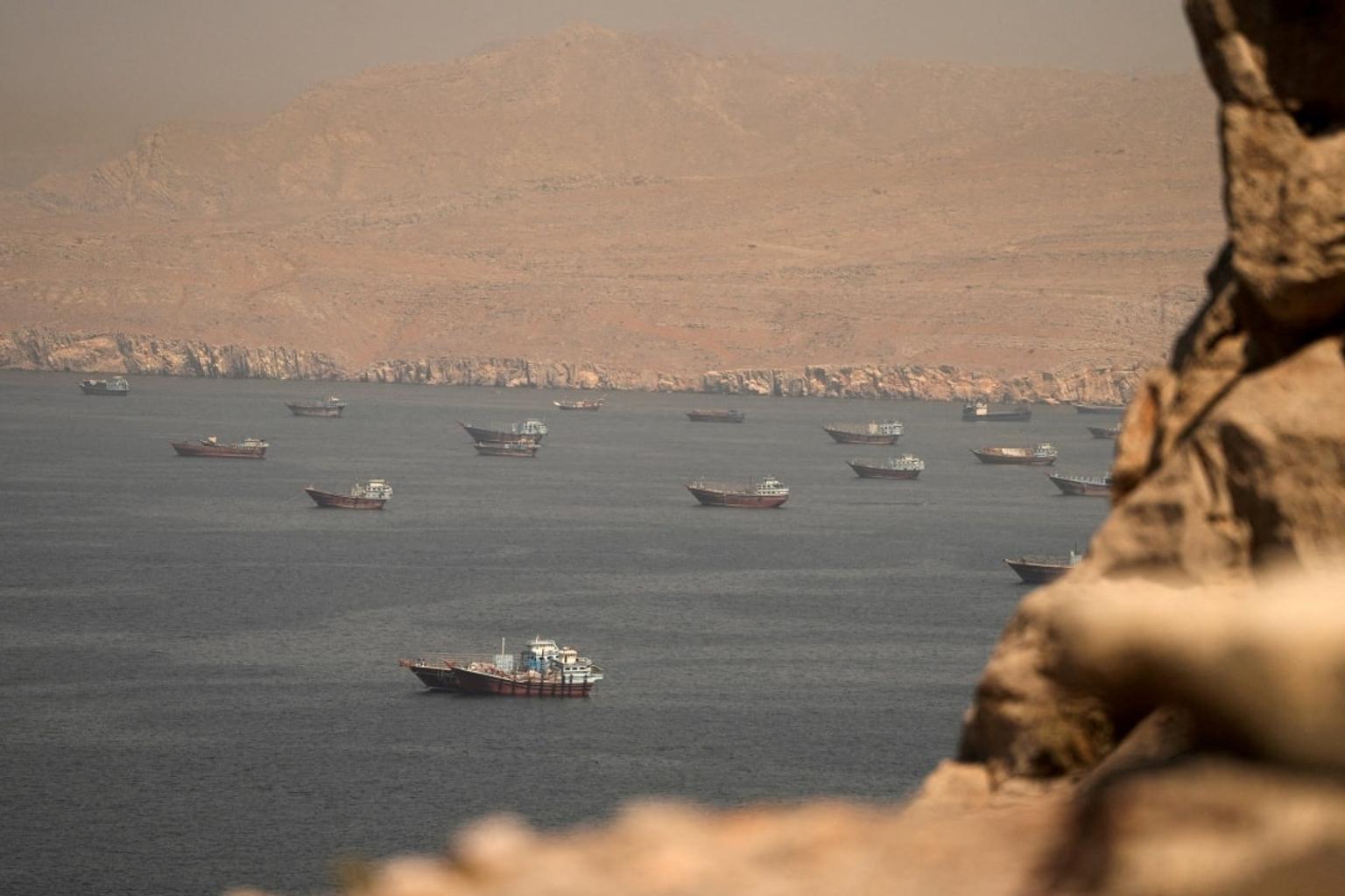 Map of the Strait of Hormuz with ships passing through