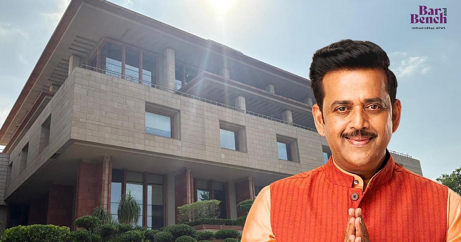 Ravi Kishan in a formal setting with a serious expression