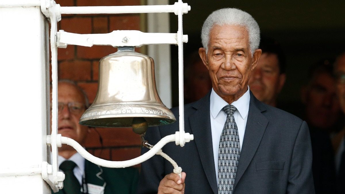 Sir Garfield Sobers in action on the cricket field with bat and ball