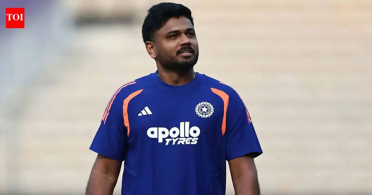 Sanju Samson in cricket action with bat and gloves