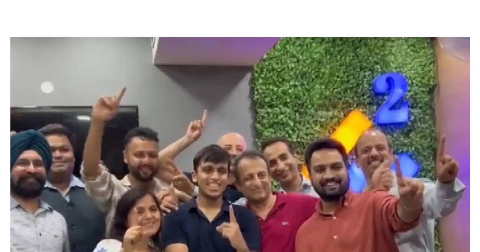 Aryan Gupta holding his NEET UG 2026 result scorecard with a smile