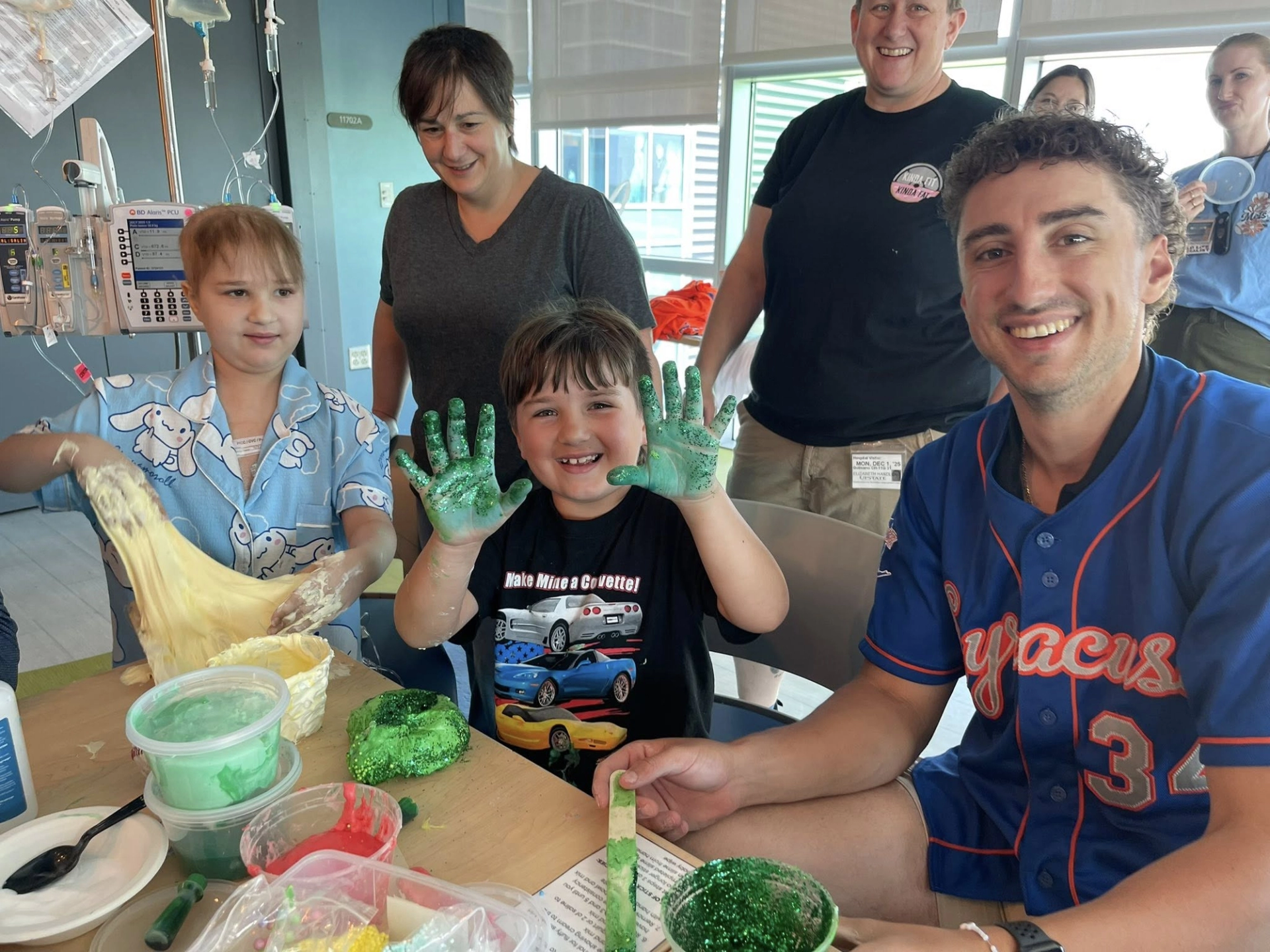 Syracuse Mets player making slime with patients at Golisano Children's Hospital
